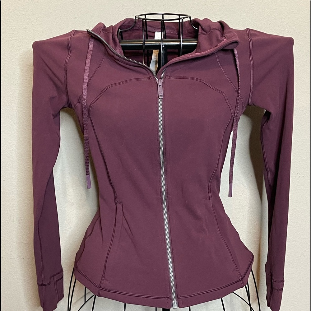 NWOT Lululemon zip up light weight hoody. Mint condition! Size 4